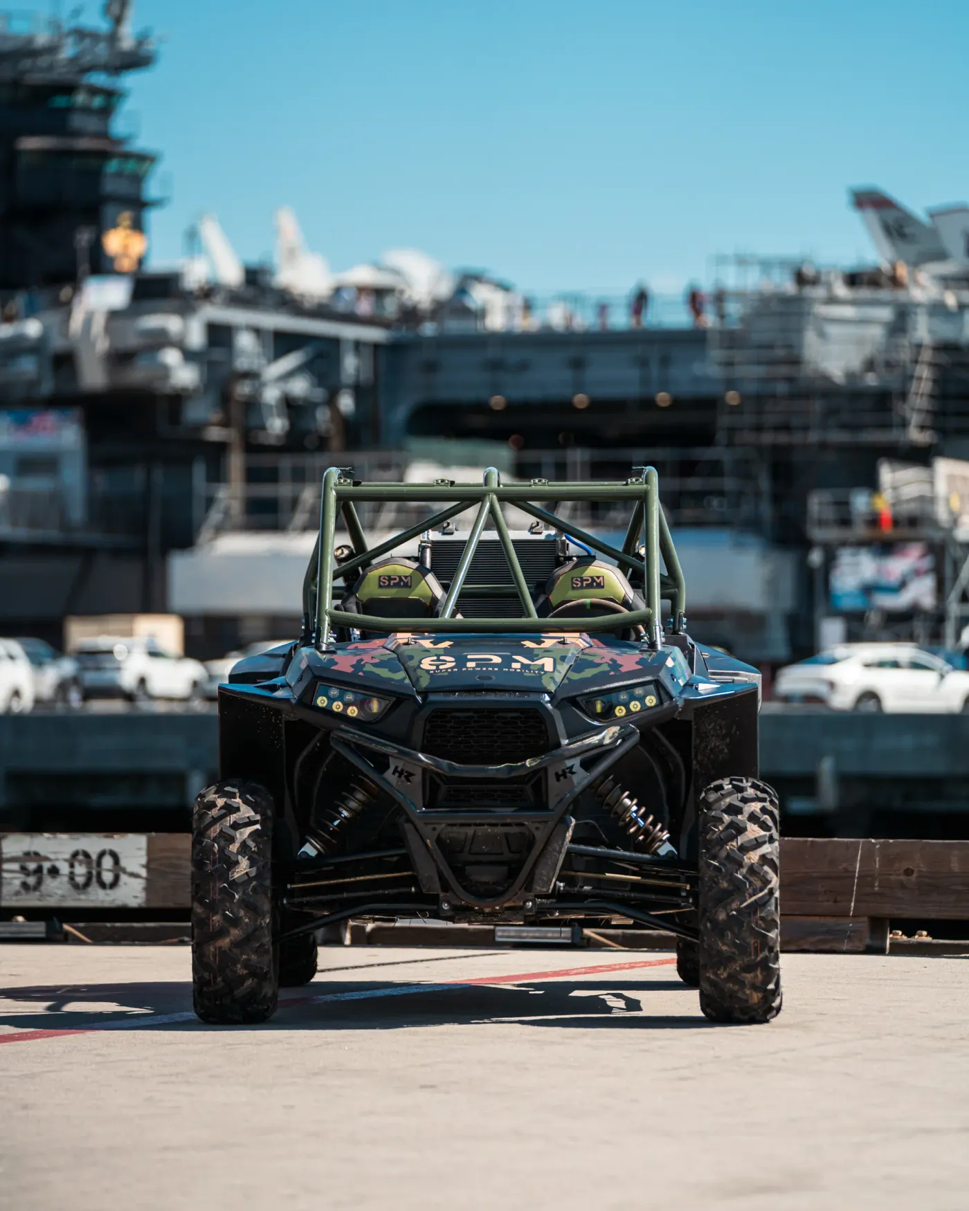 Head-on view of the SPM Alpha Prototype electric UTV on a carrier pier