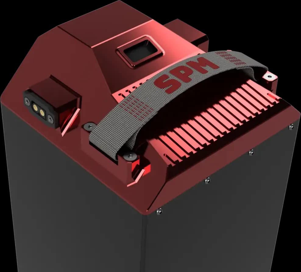 Top detail of the SPM battery pack: carry strap, cooling fins, status display and keyed power connector